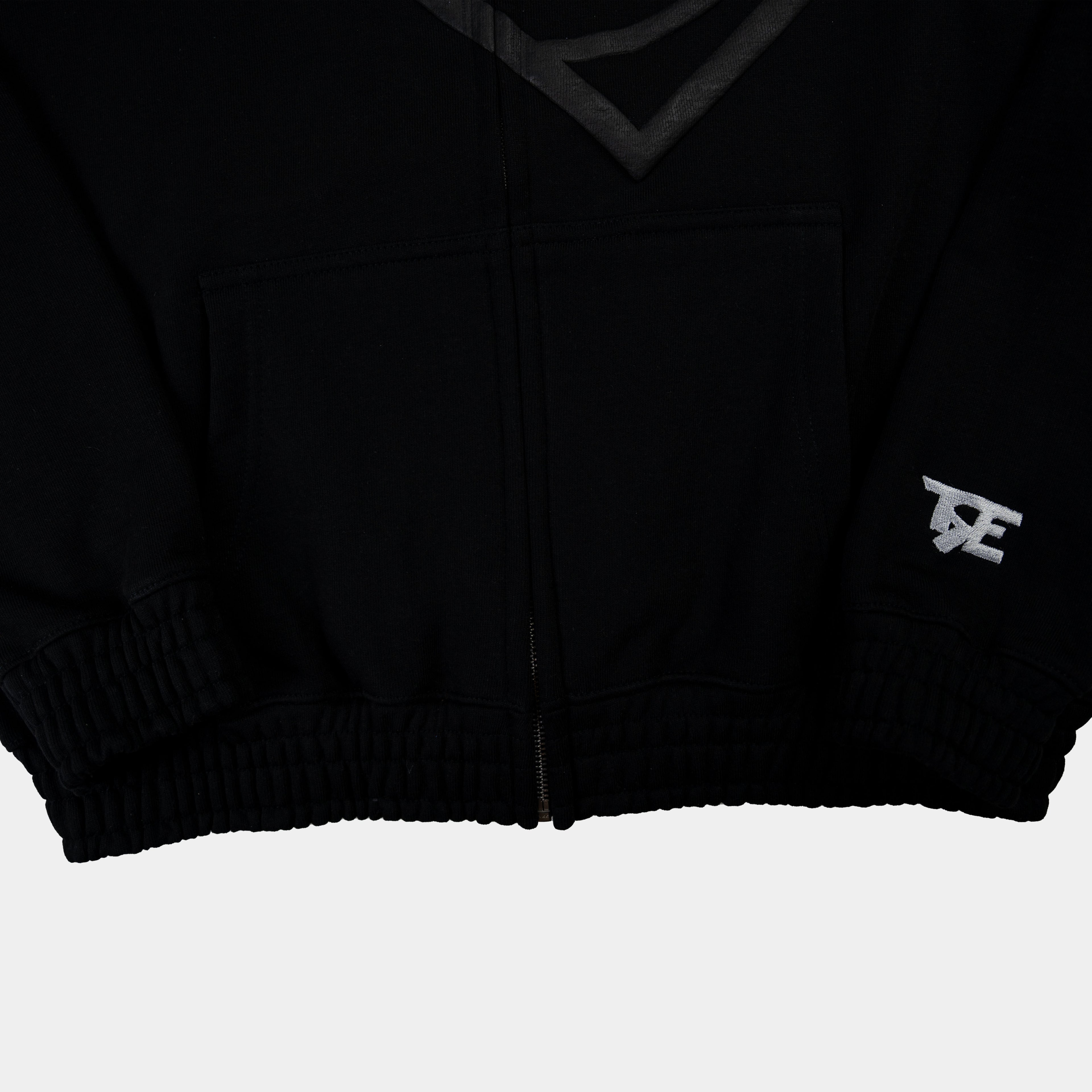 Zip Hoodie in Schwarz mit Herz Puff-Druck von Trevouse - Bund