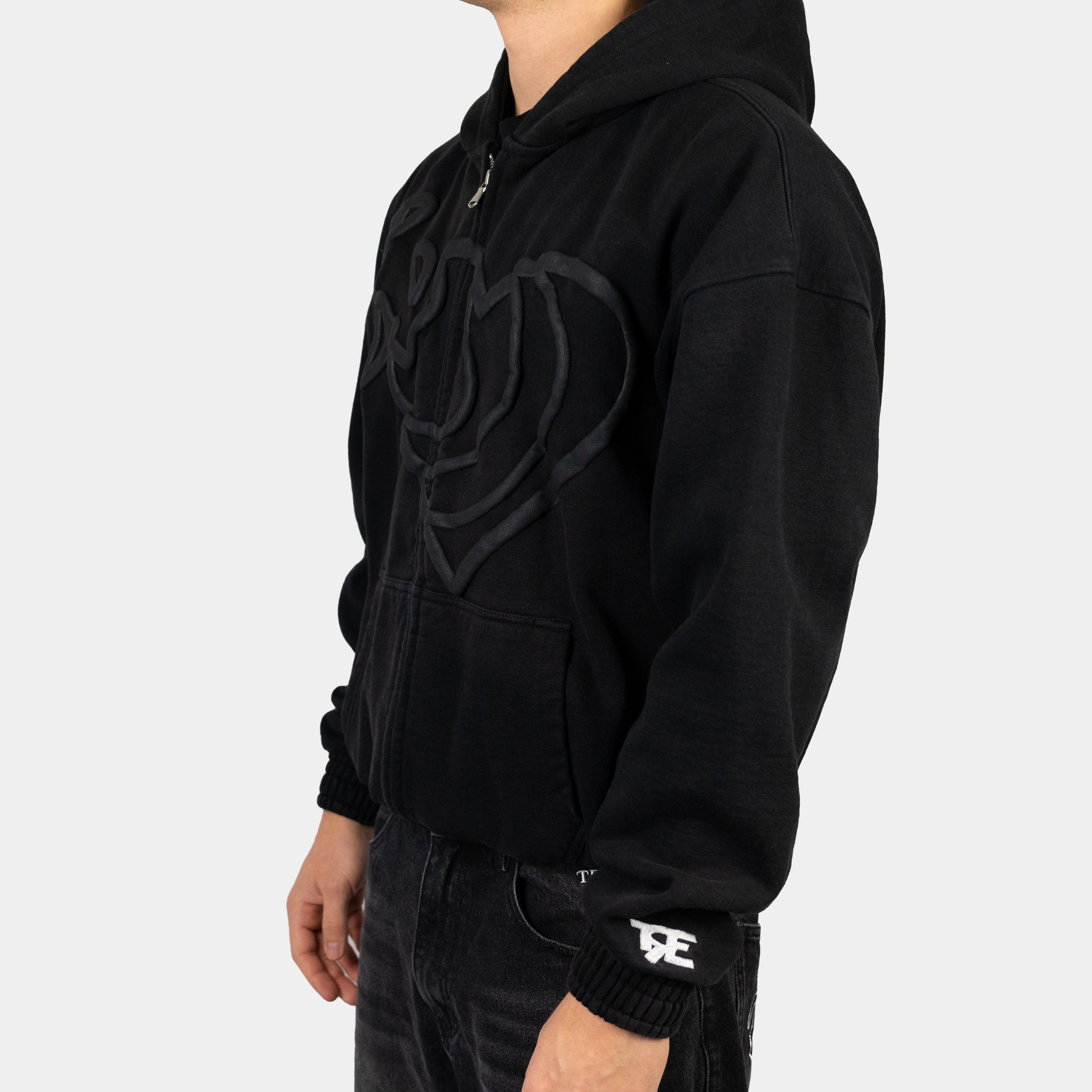 Zip Hoodie in Schwarz mit Herz Puff-Druck von Trevouse - Seitenansicht